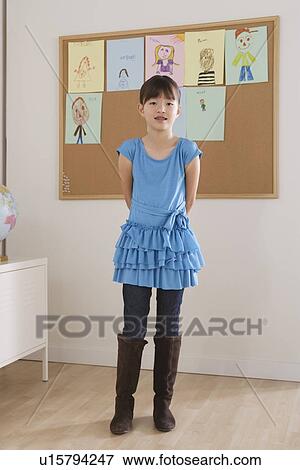 Stock Photo - Schoolgirl in classroom. Fotosearch