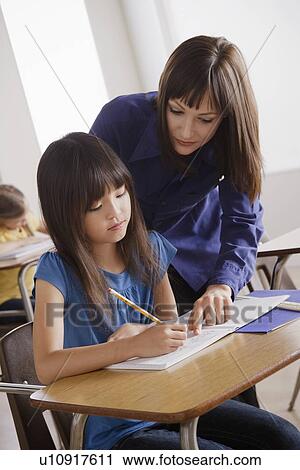 Schoolgirl with teacher View Large Photo Image Stock Image - Schoolgirl with teacher. Fotosearch