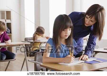 Schoolgirl with teacher View Large Photo Image Stock Photography - Schoolgirl with teacher. Fotosearch
