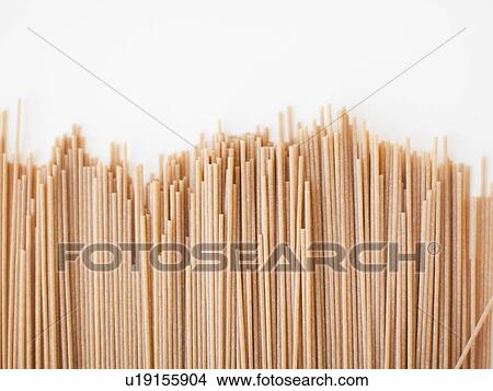 Picture - Spaghetti on white background, close-up. Fotosearch