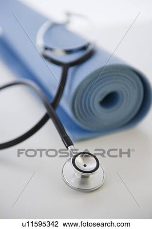 Stethoscope and exercise mat View Large Photo Image Stock Image - Stethoscope and exercise mat. Fotosearch