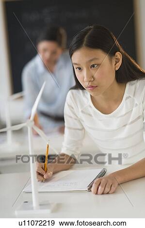 Student (14-15) examining wind turbine View Large Photo Image Stock Photo - Student (14-15) examining wind turbine. Fotosearch