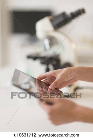Student (14-15) using tablet pc in chemistry lab View Large Photo Image Stock Image - Student (14-15) using tablet pc in chemistry lab. Fotosearch