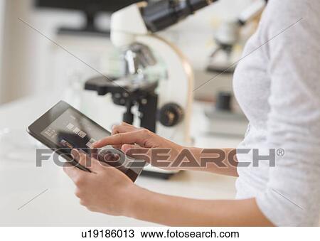 Student (14-15) using tablet pc in chemistry lab View Large Photo Image Stock Image - Student (14-15) using tablet pc in chemistry lab. Fotosearch