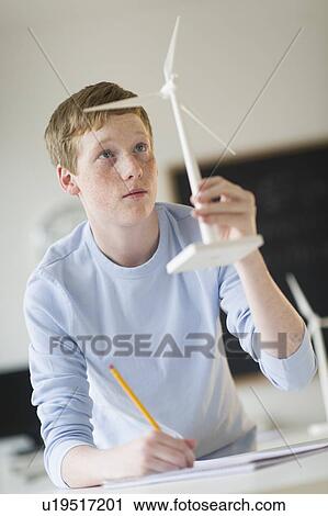 Student (16-17) examining wind turbine View Large Photo Image Stock Image - Student (16-17) examining wind turbine. Fotosearch