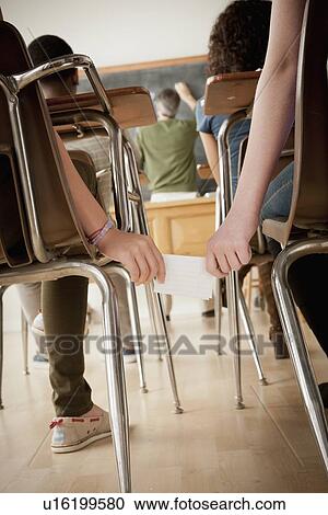 Stock Image - Students (14-15, 16-17) communicating during lesson. Fotosearch
