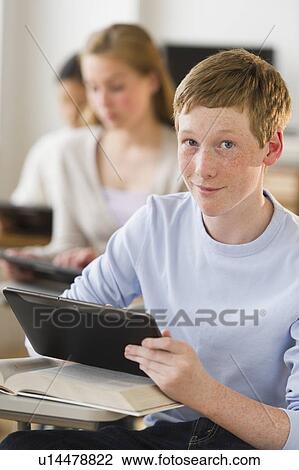 Students (14-17) using digital tablets at school View Large Photo Image Stock Image - Students (14-17) using digital tablets at school. Fotosearch