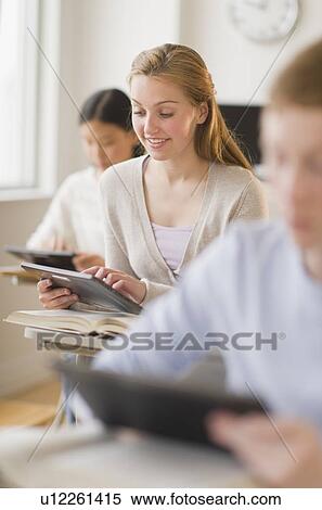 Students (14-17) using digital tablets at school View Large Photo Image Stock Photography - Students (14-17) using digital tablets at school. Fotosearch