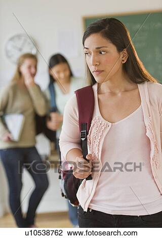 Stock Image - Students (14-19) gossiping. Fotosearch