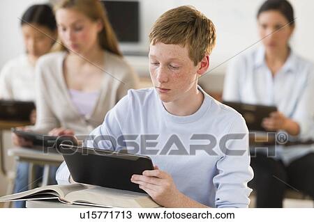 Students (14-19) using digital tablets at school View Large Photo Image Stock Image - Students (14-19) using digital tablets at school. Fotosearch