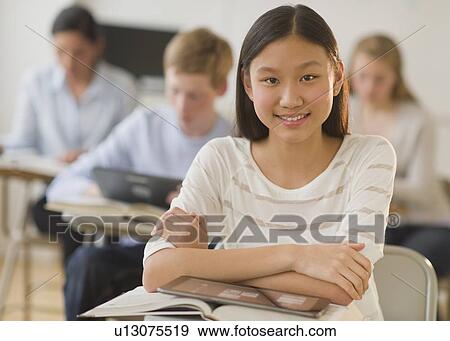 Students (14-19) using digital tablets at school View Large Photo Image Stock Photo - Students (14-19) using digital tablets at school. Fotosearch