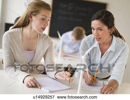 Stock Photo - Students (16-19) examining wind turbines. Fotosearch