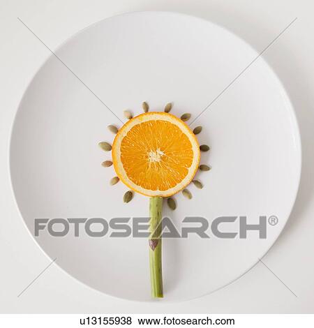 Sunflower made out of food on plate, studio shot View Large Photo Image Stock Photo - Sunflower made out of food on plate, studio shot. Fotosearch