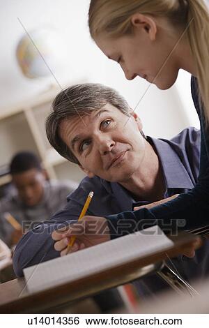 Stock Photograph - Teacher and schoolgirl (14-15). Fotosearch