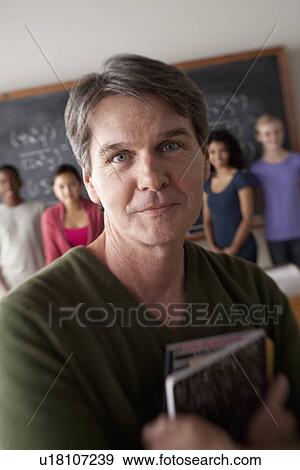 Stock Photo - Teacher and students (14-15, 16-17) at school. Fotosearch
