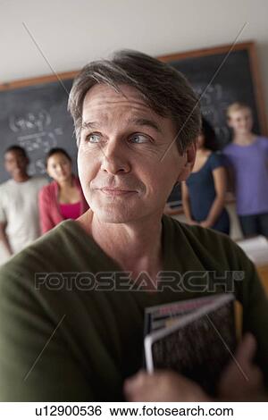 Stock Photograph - Teacher and students (14-15, 16-17) at school. Fotosearch