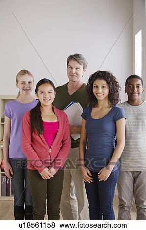 Teacher and teenage students (14-15, 16-17) View Large Photo Image Stock Photo - Teacher and teenage students (14-15, 16-17). Fotosearch