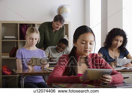 Teacher and teenage students (14-15, 16-17) View Large Photo Image Stock Photograph - Teacher and teenage students (14-15, 16-17). Fotosearch