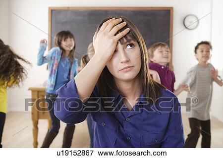 Teacher with group of pupils in front of blackboard View Large Photo Image Stock Photo - Teacher with group of pupils in front of blackboard. Fotosearch