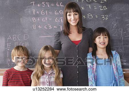 Picture - Teacher with schoolchildren (6-7, 8-9). Fotosearch