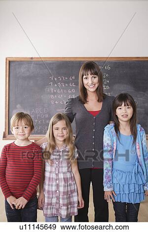 Teacher with schoolchildren (6-7, 8-9) View Large Photo Image Stock Photo - Teacher with schoolchildren (6-7, 8-9). Fotosearch