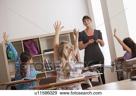Teacher with schoolchildren (6-7, 8-9) View Large Photo Image Stock Photo - Teacher with schoolchildren (6-7, 8-9). Fotosearch