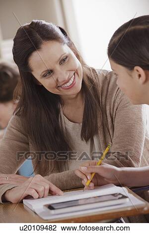 Teacher with schoolgirl (12-13) View Large Photo Image Stock Image - Teacher with schoolgirl (12-13). Fotosearch