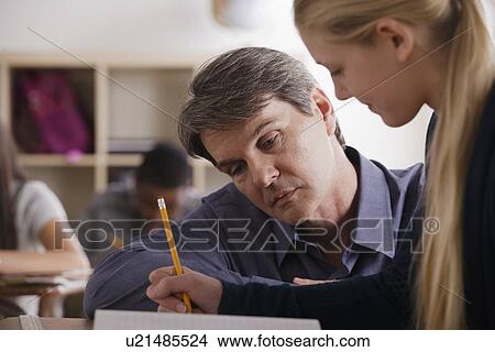 Picture - Teacher with teenage students (14-15) at school. Fotosearch