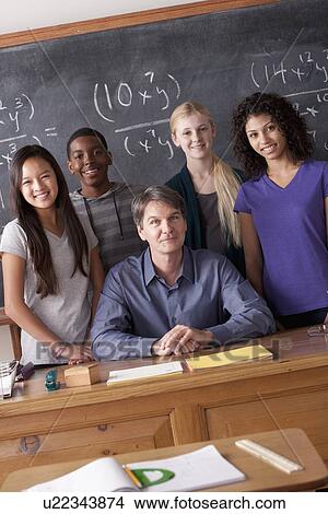 Picture - Teacher with teenage students (14-15, 16-17) at school. Fotosearch