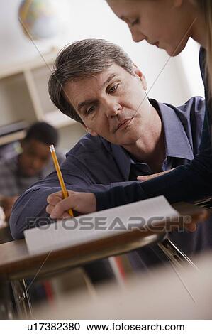 Teacher with teenage students (14-15) at school View Large Photo Image Stock Image - Teacher with teenage students (14-15) at school. Fotosearch