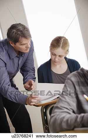 Teacher with teenage students (14-15) at school View Large Photo Image Stock Image - Teacher with teenage students (14-15) at school. Fotosearch