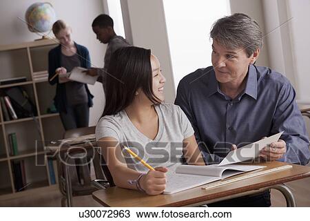 Teacher with teenage students (14-15) at school View Large Photo Image Stock Image - Teacher with teenage students (14-15) at school. Fotosearch