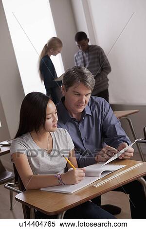 Teacher with teenage students (14-15) at school View Large Photo Image Stock Photography - Teacher with teenage students (14-15) at school. Fotosearch