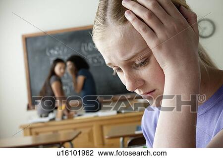 Stock Image - Teenage girls (14-15, 16-17) at school. Fotosearch