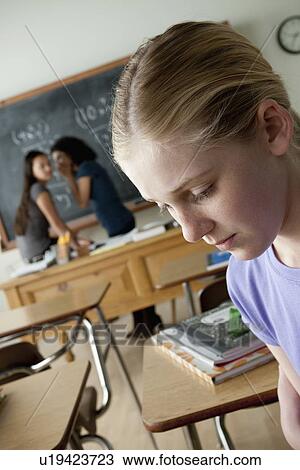 Stock Image - Teenage girls (14-15, 16-17) at school. Fotosearch