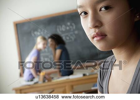 Stock Photo - Teenage girls (14-15, 16-17) at school. Fotosearch