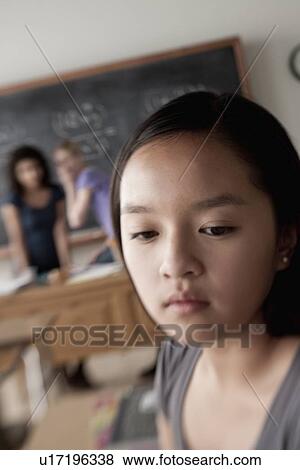 Stock Photo - Teenage girls (14-15, 16-17) at school. Fotosearch