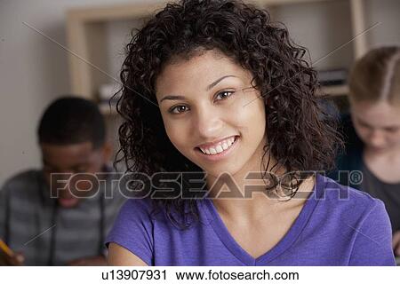 Stock Image - Teenage students (14-15, 16-17) at school. Fotosearch