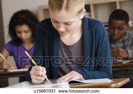 Teenage students (14-15, 16-17) at school View Large Photo Image Stock Image - Teenage students (14-15, 16-17) at school. Fotosearch