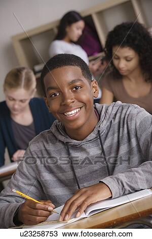 Teenage students (14-15, 16-17) at school View Large Photo Image Stock Image - Teenage students (14-15, 16-17) at school. Fotosearch