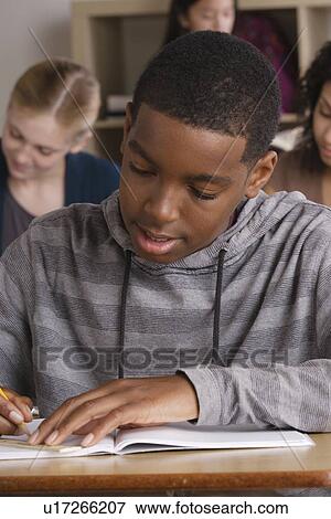 Teenage students (14-15, 16-17) at school View Large Photo Image Stock Photo - Teenage students (14-15, 16-17) at school. Fotosearch