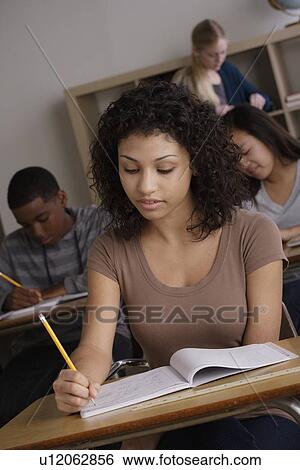 Stock Photograph - Teenage students (14-15, 16-17) at school. Fotosearch