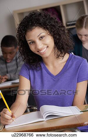 Stock Photograph - Teenage students (14-15, 16-17) at school. Fotosearch