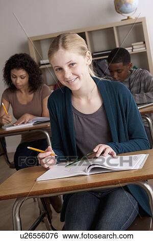 Stock Photograph - Teenage students (14-15) at school. Fotosearch