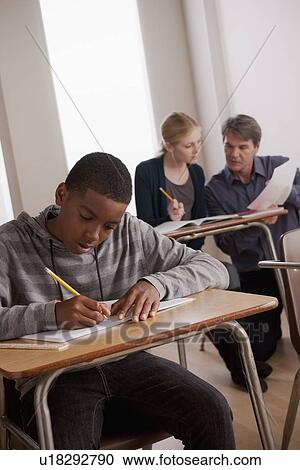 Stock Image - Teenagers(14-15) at school. Fotosearch