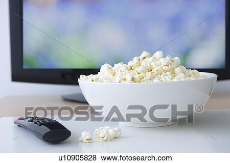 Stock Photo - Television set and bowl of popcorn. Fotosearch