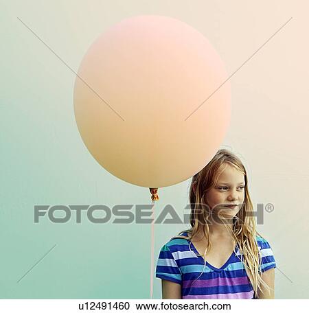 Texas, Austin, Blonde girl holding big balloon View Large Photo Image Stock Image - Texas, Austin, Blonde girl holding big balloon. Fotosearch