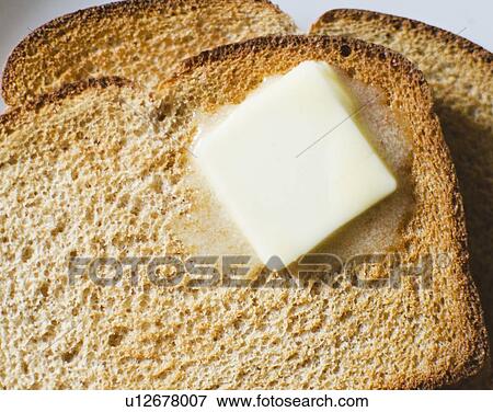 Toast with meltin butter View Large Photo Image Stock Photo - Toast with meltin butter. Fotosearch