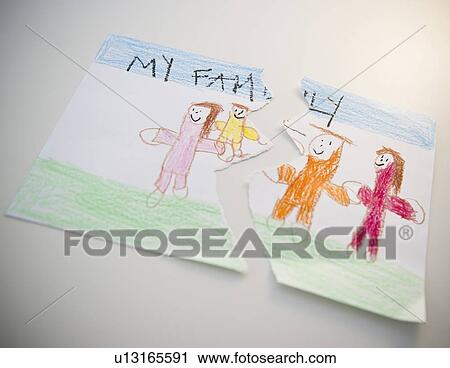 Stock Image - Torn child's drawing depicting family. Fotosearch