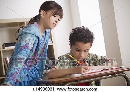 Stock Image - Two children (8-9) at school. Fotosearch